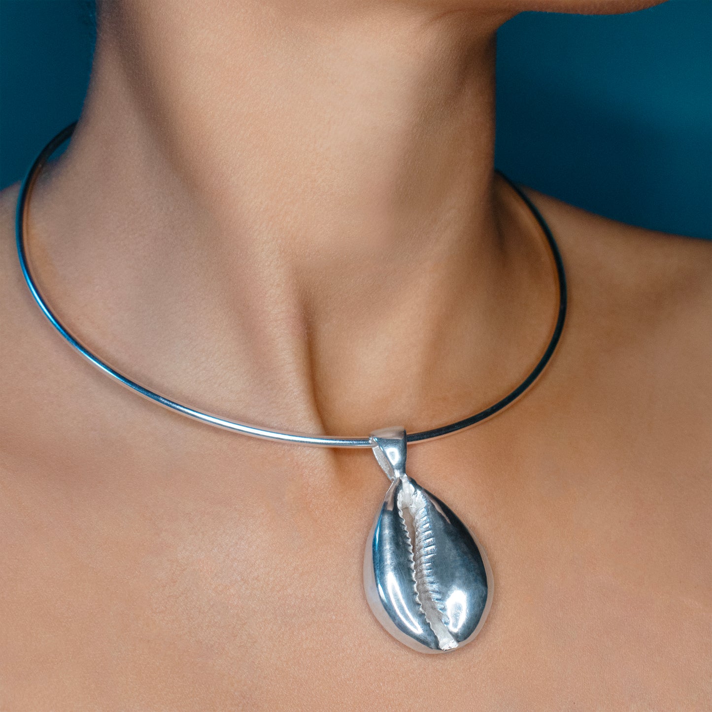 Cowrie shell pendant